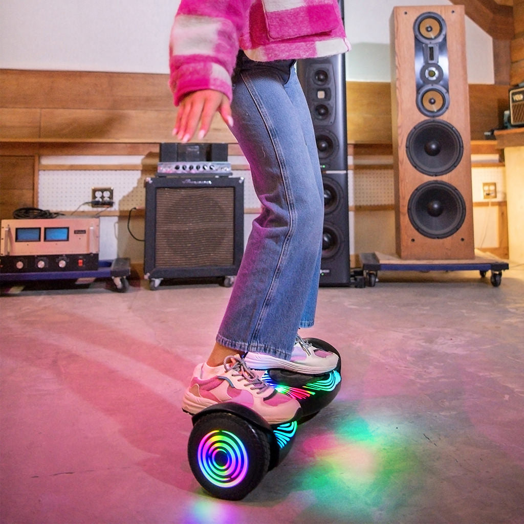 close up of a young person riding the J-beat hoverboard