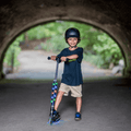 young kid standing and holding onto jupiter kick scooter handlebars