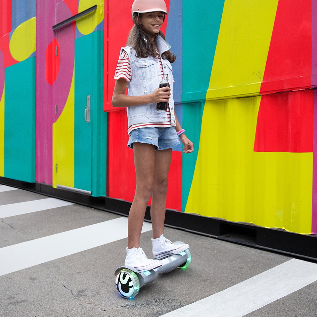 young girl riding and having fun on the Litho X Hoverboard