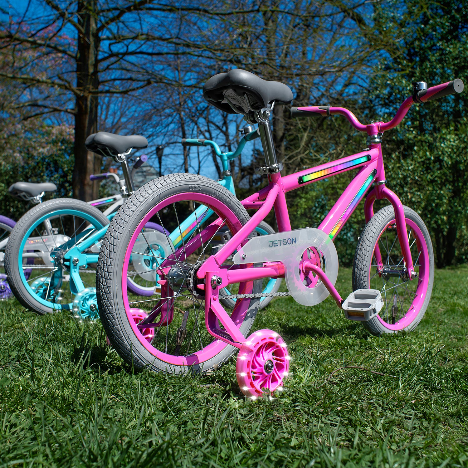 row of pink blue and grey light up bikes