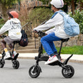 the backside of two people riding their LX10s