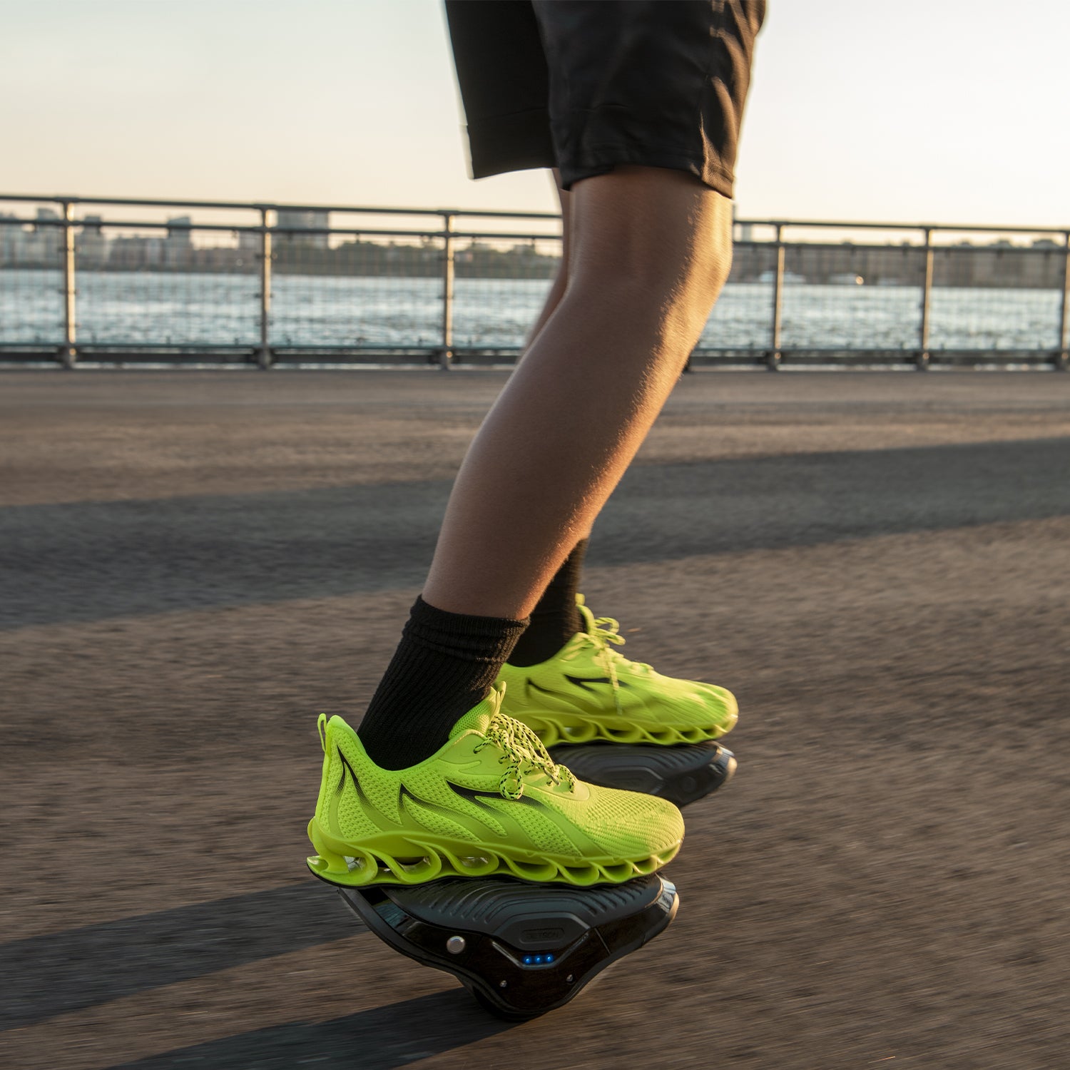 close up of a person riding the MotoKicks on a pier