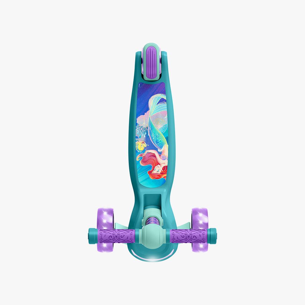 overhead shot of the green and purple little mermaid scooter