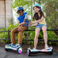 two people hanging out and having fun with their feet on top of their Plasma X hoverboards
