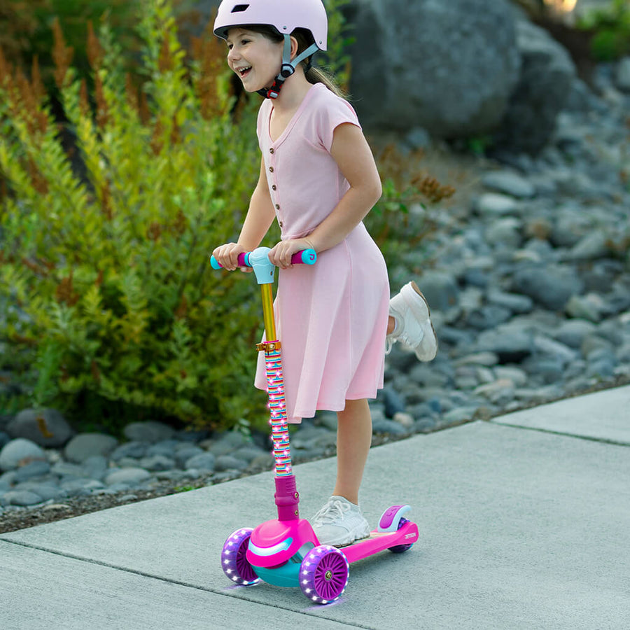 pink three wheel kick scooter with light up wheels facing left