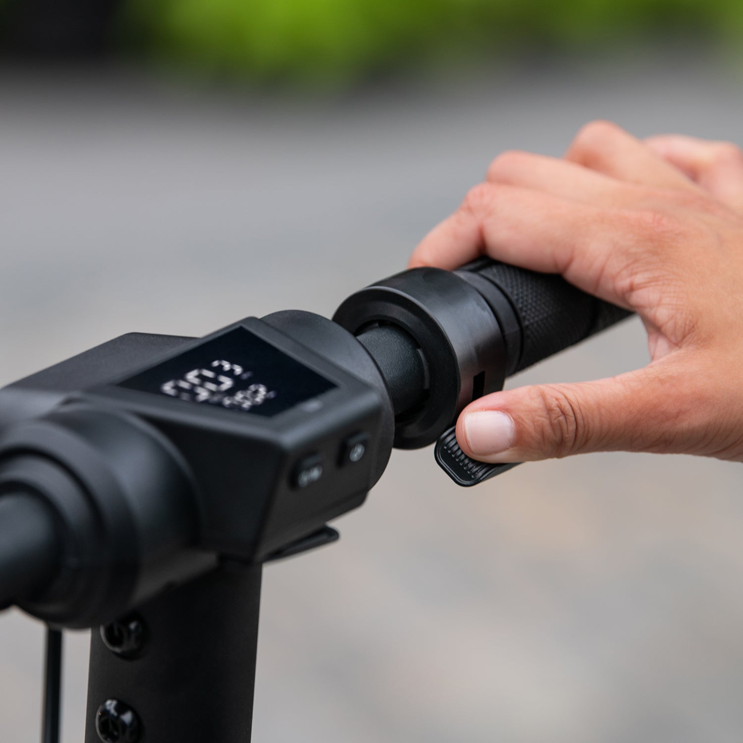 close up a persons hand on the right handle bar and also pressing the bell with their thumb