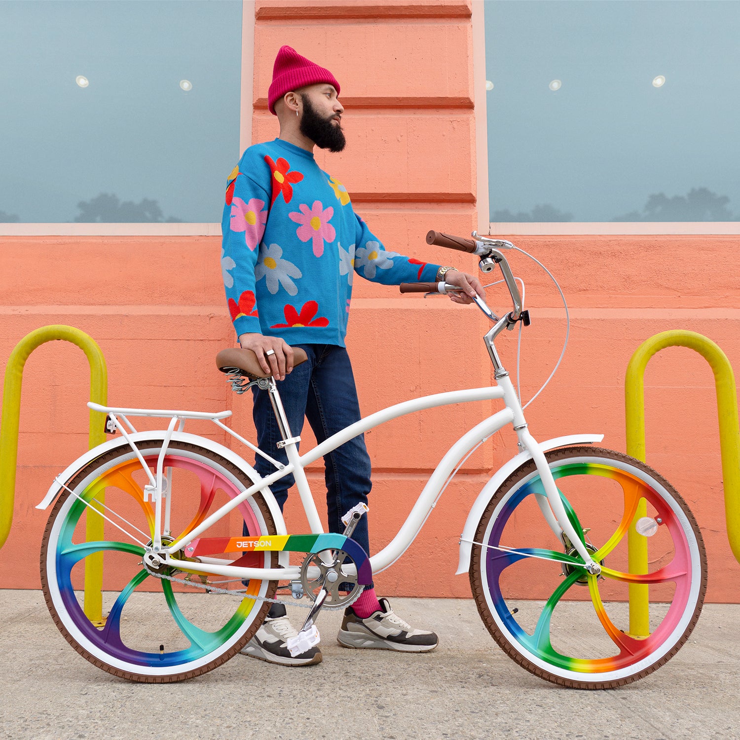 person standing on the sidewalk with the Zephyr bike facing left