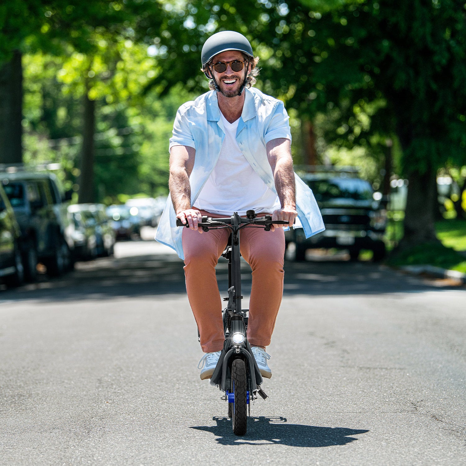 front view of person riding the Ryder down a street