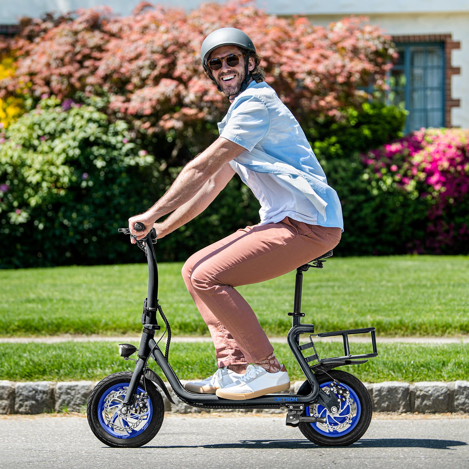 person turning their head to the side and smiling while riding the Ryder