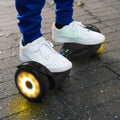 close up of the boy's feet riding the Zone hoverboard